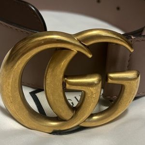 Pink woman’s Gucci belt